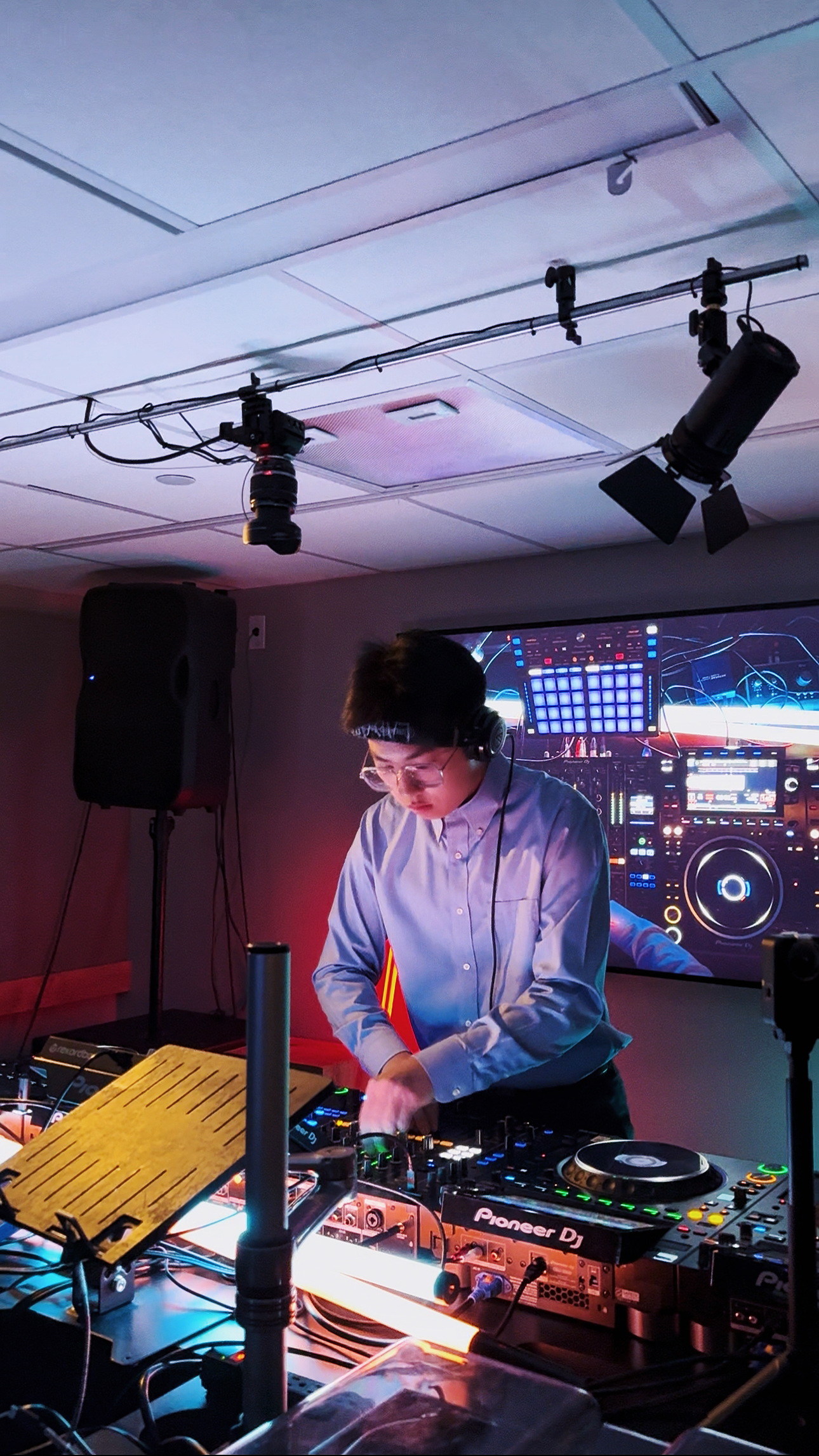 Ryan Xiong performing with DJ equipment